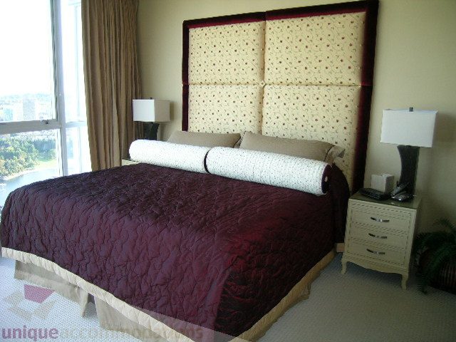 Spacious 3-bedroom condo with a large bed, patterned headboard, and city view. - 4303 - 1408 Strathmore Mews, Vancouver Downtown