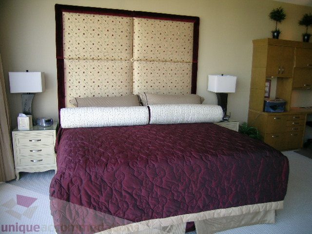Furnished 3-bedroom condo with large bed, patterned headboard, and wooden dresser. - 4303 - 1408 Strathmore Mews, Vancouver Downtown