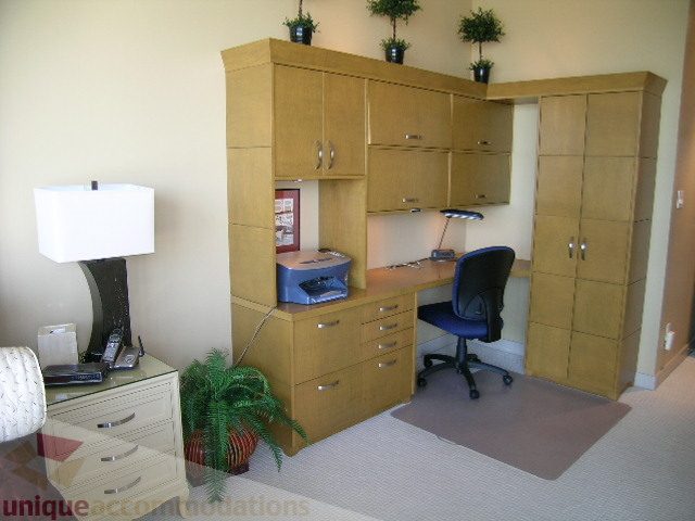 Furnished office space with wooden cabinets, desk, and filing drawers. - 4303 - 1408 Strathmore Mews, Vancouver Downtown