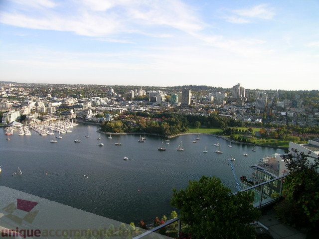 Bright living room with panoramic city view and waterfront access. - 4303 - 1408 Strathmore Mews, Vancouver Downtown