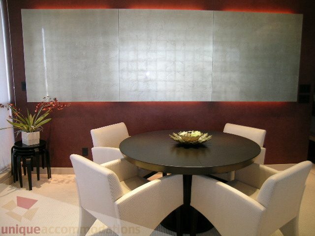 Furnished living room with modern furniture, large artwork, and indoor plants. - 4303 - 1408 Strathmore Mews, Vancouver Downtown