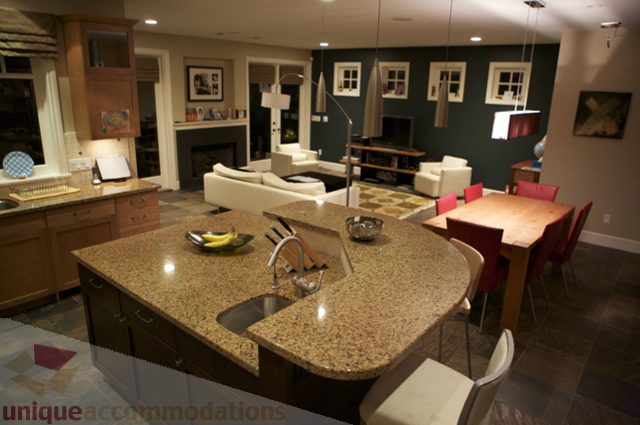 Furnished living room with granite countertops and modern decor. - 3781 Bayridge Ave, West Vancouver