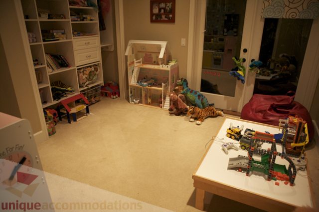 Bright playroom with toys, dollhouse, and Lego set. - 3781 Bayridge Ave, West Vancouver