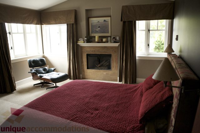 Spacious living room with a fireplace, modern furniture, and large windows. - 3781 Bayridge Ave, West Vancouver
