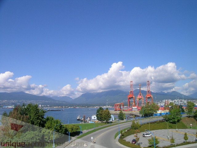 Furnished living room with city view and waterfront access. - 137 Alexander Street, Vancouver Downtown