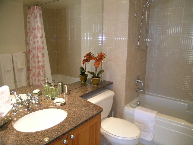 Bathroom with granite countertops, modern fixtures, and a shower. - 1102 - 1723 Alberni Street, Vancouver Downtown