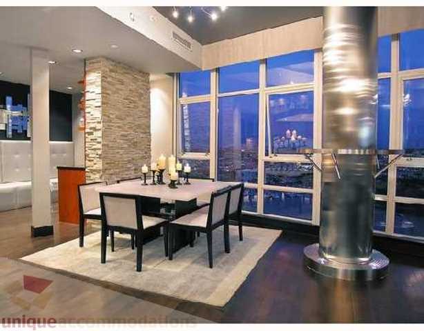 Furnished dining area with city view and modern decor. - 3202 - 1483 Homer Street, Vancouver Downtown