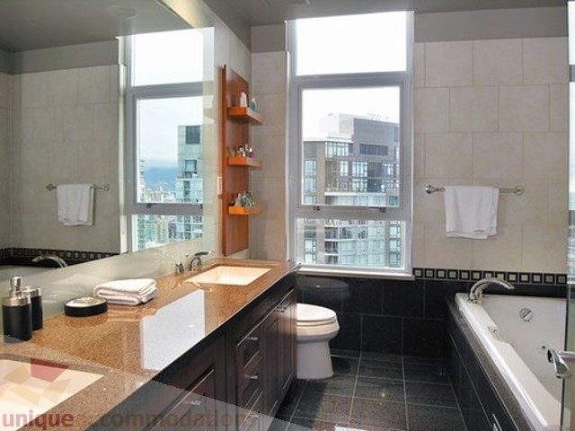 Bright bathroom with granite countertops, city view, and modern fixtures. - 3202 - 1483 Homer Street, Vancouver Downtown