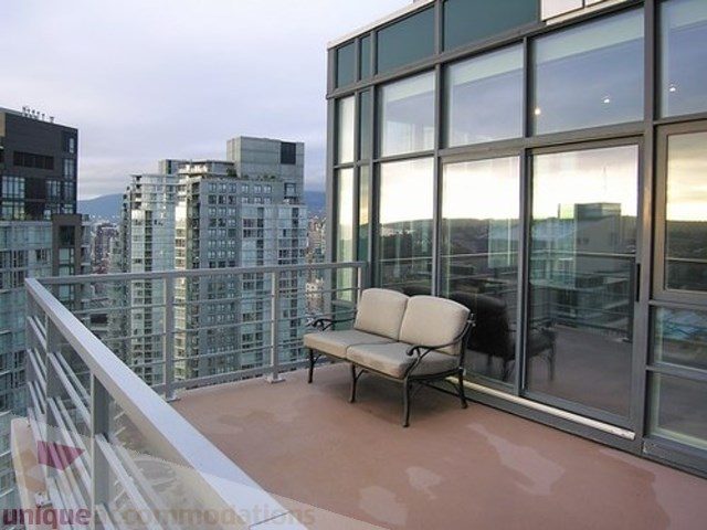 Furnished balcony with city view and modern furniture. - 3202 - 1483 Homer Street, Vancouver Downtown