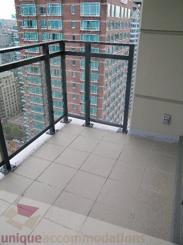 Bright balcony with city view and modern railings. - 2804-788 Richards Street, Vancouver Downtown