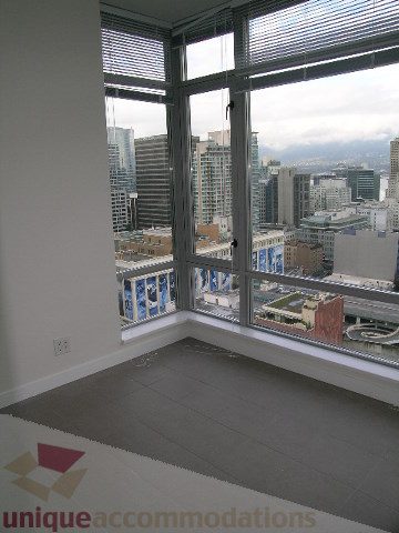 Spacious living room with city view and large windows. - 2804-788 Richards Street, Vancouver Downtown