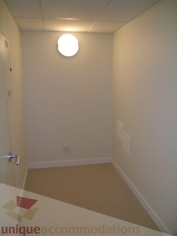 Bright hallway with white walls and ceiling light. - 2804-788 Richards Street, Vancouver Downtown
