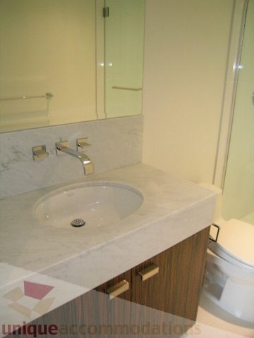 Bathroom with marble countertop and modern fixtures. - 2804-788 Richards Street, Vancouver Downtown