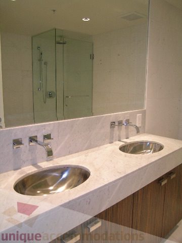 Bathroom with dual sinks, marble countertop, and glass shower. - 2804-788 Richards Street, Vancouver Downtown