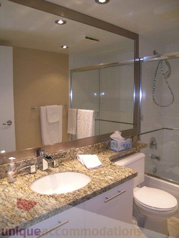 Spacious bathroom with granite countertops and a walk-in shower. - 1205 - 1331 West Georgia Street, Vancouver Downtown