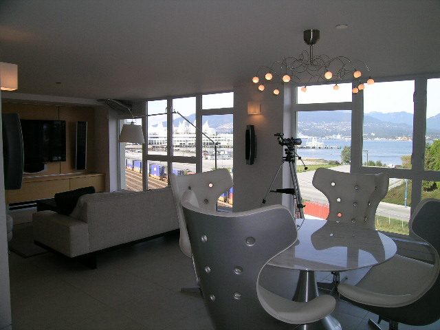 Bright living room with city view and modern furniture. - 708 - 27 Alexander Street, Vancouver Downtown