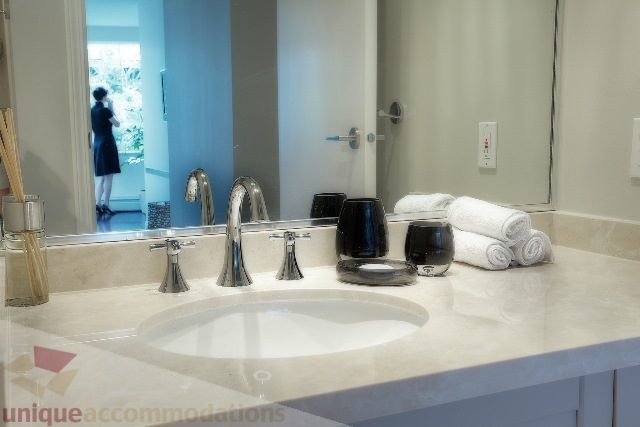 Furnished bathroom with marble countertops and modern fixtures. - Townhouse 117 - 118 Drake Street, Vancouver Downtown