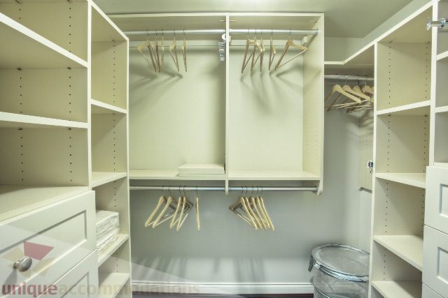 Spacious walk-in closet with multiple shelves and hangers. - Townhouse 117 - 118 Drake Street, Vancouver Downtown