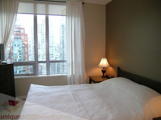 Bright bedroom with large windows and city view. - 1602 - 1005 Beach Ave., Vancouver Downtown