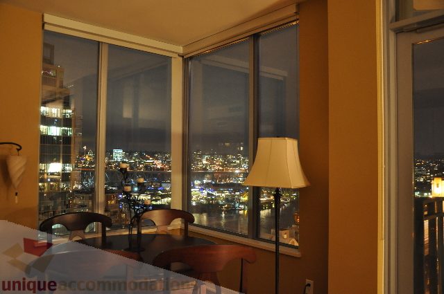 Spacious living room with city view and modern furnishings. - 1602 - 1005 Beach Ave., Vancouver Downtown
