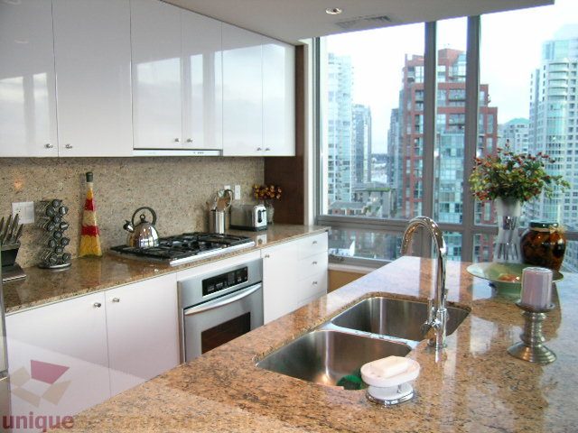 Bright kitchen with granite countertops, stainless steel appliances, and a stunning city view. - 1602 - 1005 Beach Ave., Vancouver Downtown