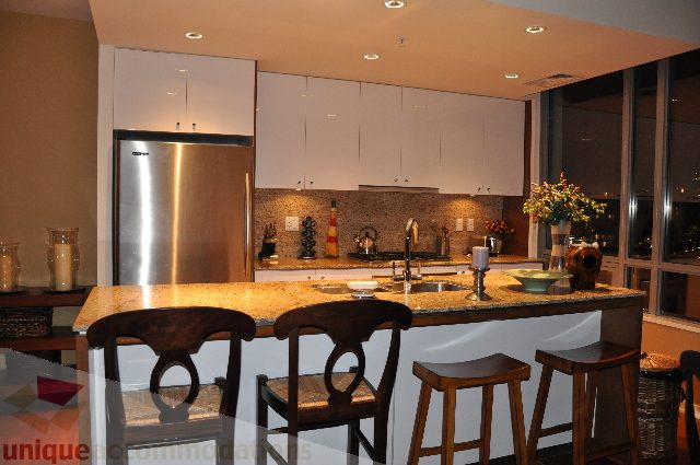 Bright kitchen with granite countertops, modern appliances, and a city view. - 1602 - 1005 Beach Ave., Vancouver Downtown