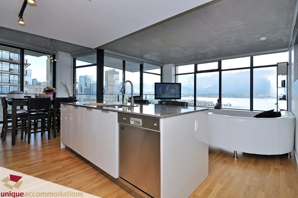 Bright kitchen with modern island, hardwood floors, and stunning city view. - 1409 - 108 West Cordova, Vancouver Downtown