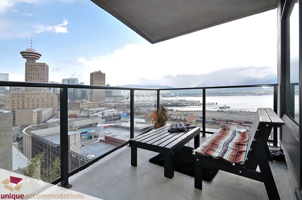 Furnished balcony with city view, modern furniture, and a cozy atmosphere. - 1409 - 108 West Cordova, Vancouver Downtown
