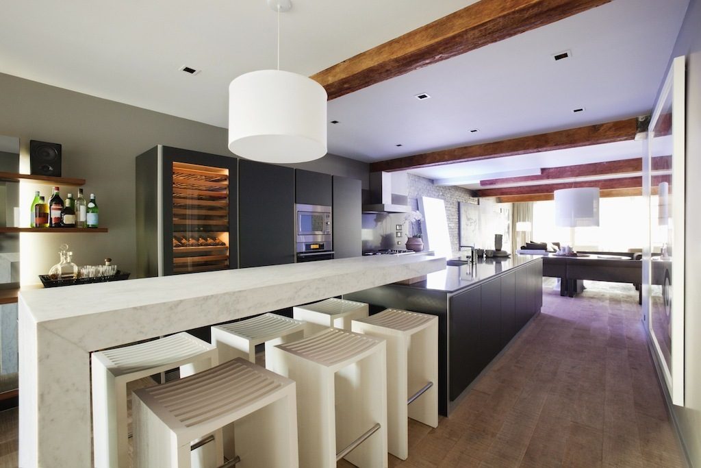 Bright kitchen with marble countertops, hardwood floors, and a modern design. - 30 - 133 Keefer Street, Vancouver Downtown