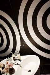 Framed circular wall art with black and white spiral design, modern sink with flowers. - 30 - 133 Keefer Street, Vancouver Downtown