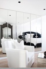 Furnished loft with mirrored walls, modern furniture, and a sleek design. - 30 - 133 Keefer Street, Vancouver Downtown