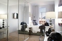 Bright and airy loft with large windows offering a city view, modern furnishings, and a cozy living area. - 40 - 133 Keefer Street, Vancouver Downtown