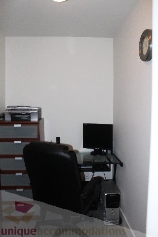 Office space with a desk, chair, printer, and monitor. - 705 - 565 Smithe Street, Vancouver Downtown