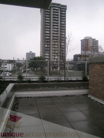 Spacious patio with city view and modern furnishings. - 1309 Civic Place Mews, North Vancouver