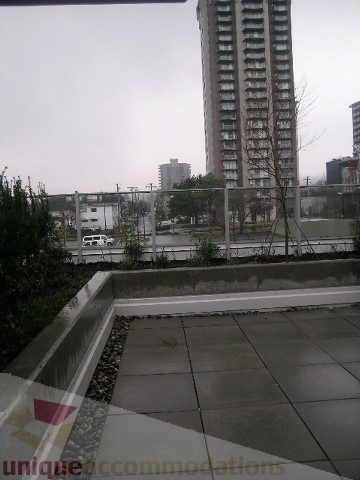 Spacious patio with city view and modern furnishings. - 1309 Civic Place Mews, North Vancouver