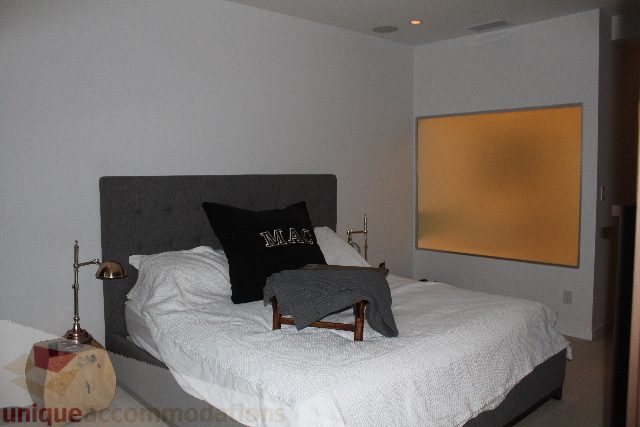 Furnished 1-bedroom with cozy bed and modern decor. - 701 - 546 Beatty Street, Vancouver Downtown