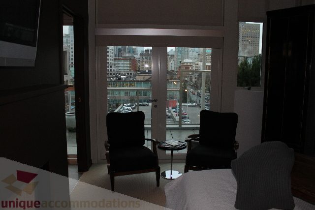 Furnished living room with city view and modern furniture. - 701 - 546 Beatty Street, Vancouver Downtown