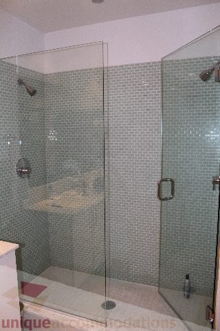 Bright bathroom with glass shower and light green tiles. - 701 - 546 Beatty Street, Vancouver Downtown