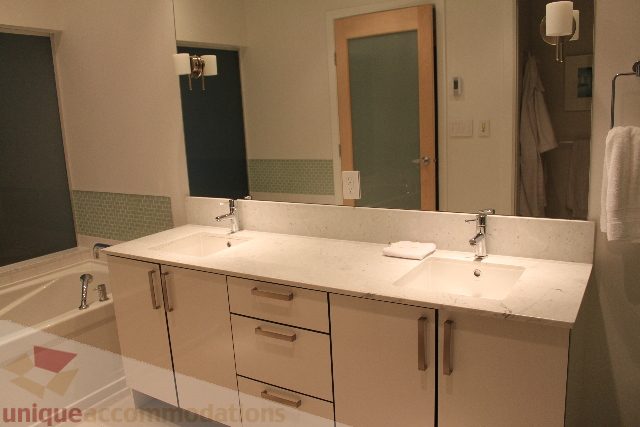 Bright bathroom with marble countertops and a modern sink setup. - 701 - 546 Beatty Street, Vancouver Downtown