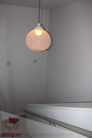 Bright bathroom with white countertop and hanging light fixture. - 701 - 546 Beatty Street, Vancouver Downtown