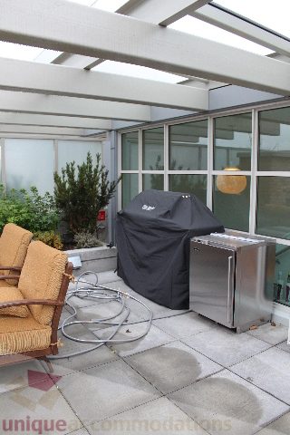 Bright patio with outdoor grill, BBQ cover, and patio furniture. - 701 - 546 Beatty Street, Vancouver Downtown