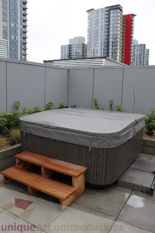 Furnished rooftop patio with hot tub and city view. - 701 - 546 Beatty Street, Vancouver Downtown