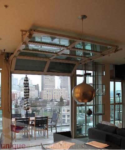 Bright living room with glass ceiling, city view, and modern decor. - 701 - 546 Beatty Street, Vancouver Downtown