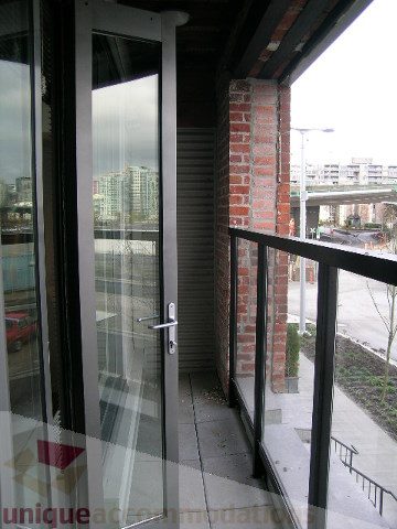 Balcony with city view and brick pillar. - 216 - 388 West 1st Avenue, Vancouver West Side