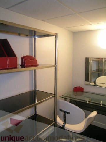 Furnished living room with modern glass table and white chair. - 1106 - 788 Richards Street, Vancouver Downtown