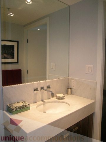Furnished bathroom with marble countertop and modern sink. - 1106 - 788 Richards Street, Vancouver Downtown
