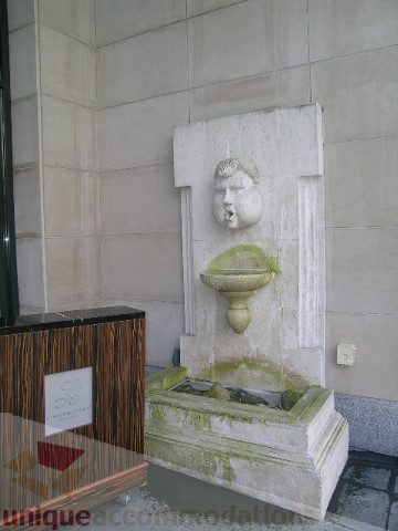 Fountain with stone sculpture in corner, green moss growth. - 1106 - 788 Richards Street, Vancouver Downtown