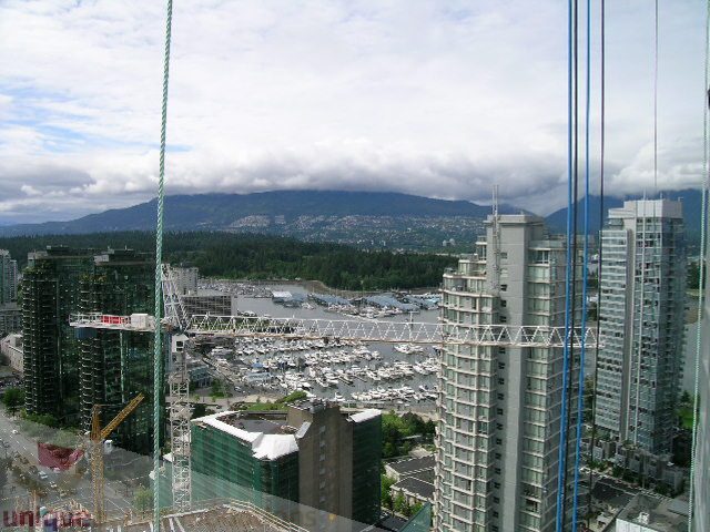 Bright living room with stunning city view and modern furnishings. - 907 - 1189 Melville Street, Vancouver Downtown