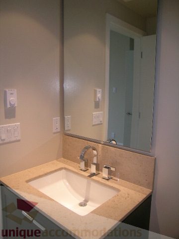 Bathroom with granite countertop and modern faucet. - 1903 - 1320 Chesterfield Street, North Vancouver