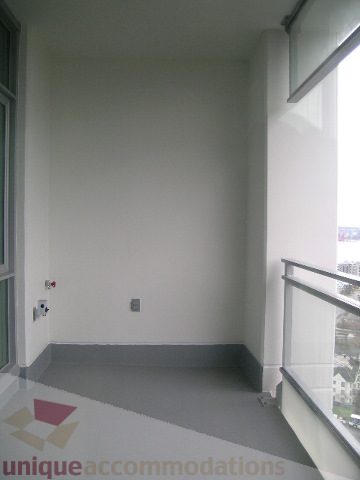 Spacious living room with city view and modern decor. - 1903 - 1320 Chesterfield Street, North Vancouver